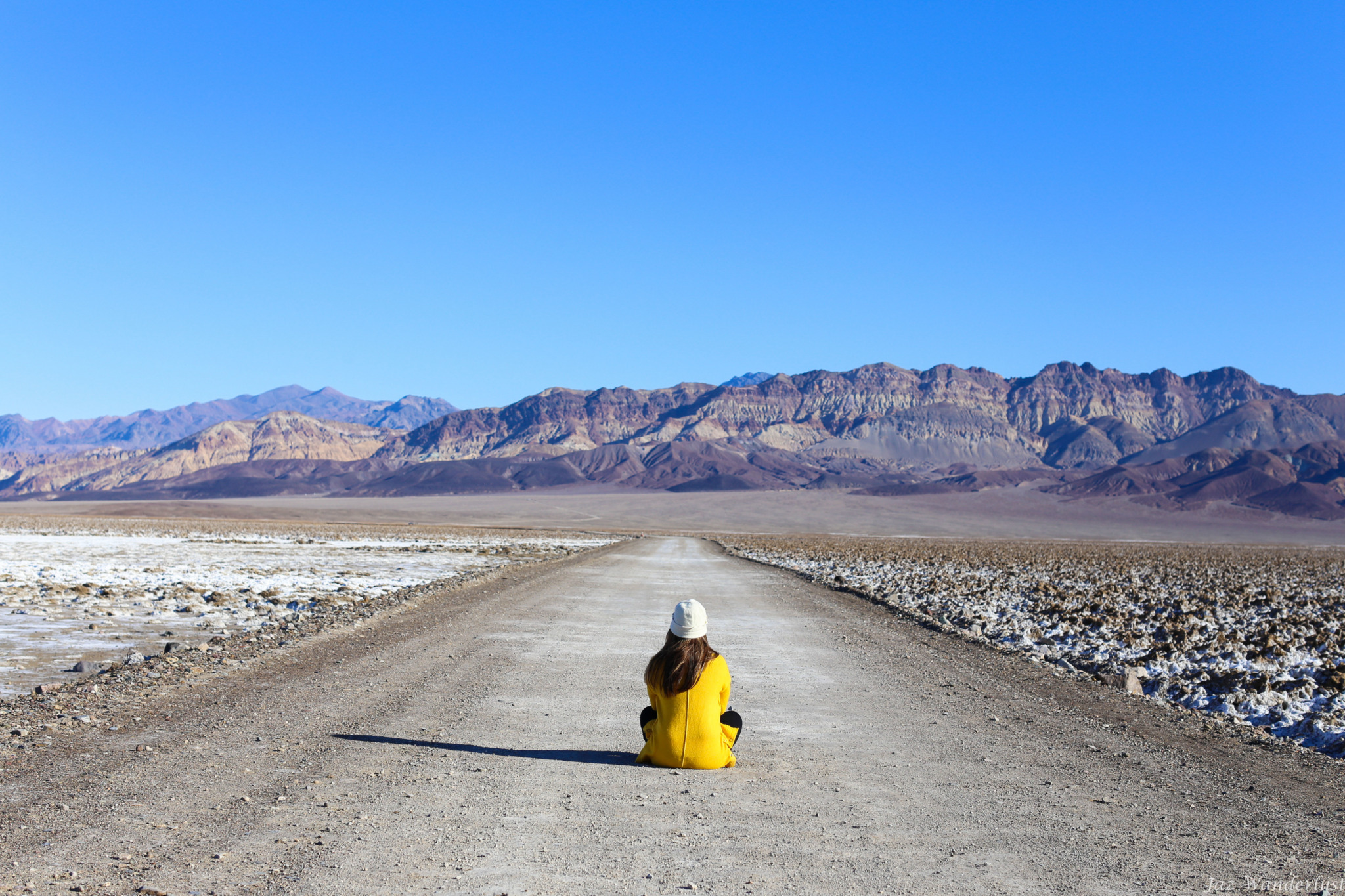 Woman on path looking at Death Valley landscape. Photography by Jaz Wanderlust.
